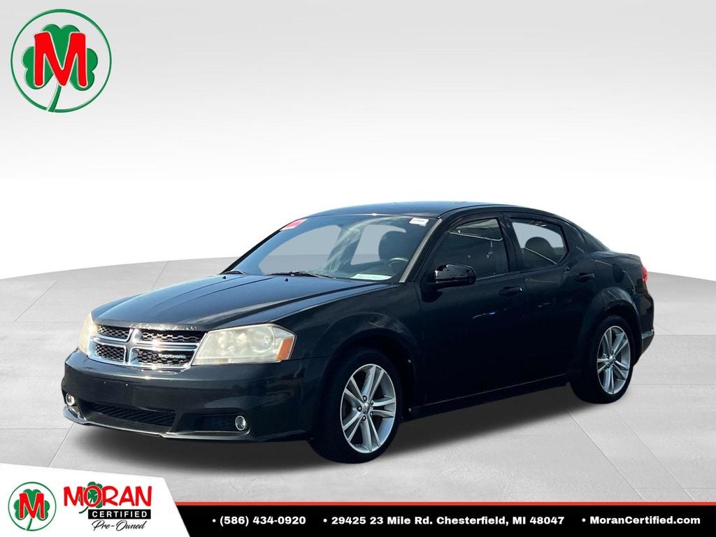 2011 Dodge Avenger Heat in Brilliant Black Crystal Pearl — front three-quarter view