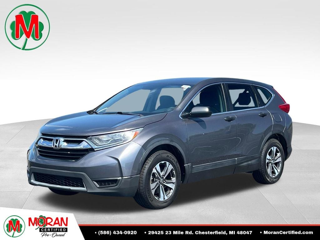 2018 Honda CR-V LX in Sandstorm Metallic — front three-quarter view