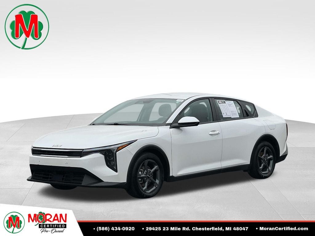 2025 Kia K4 LXS in Snow White Pearl — front three-quarter view