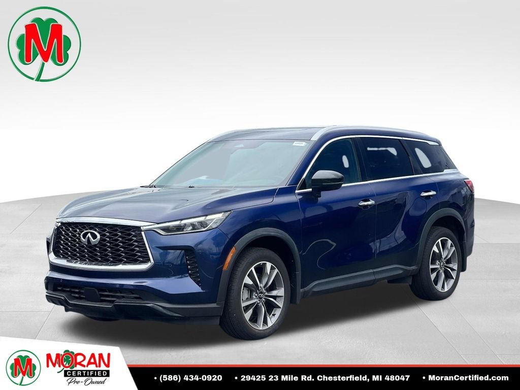 2025 INFINITI QX60 LUXE in Blue — front three-quarter view